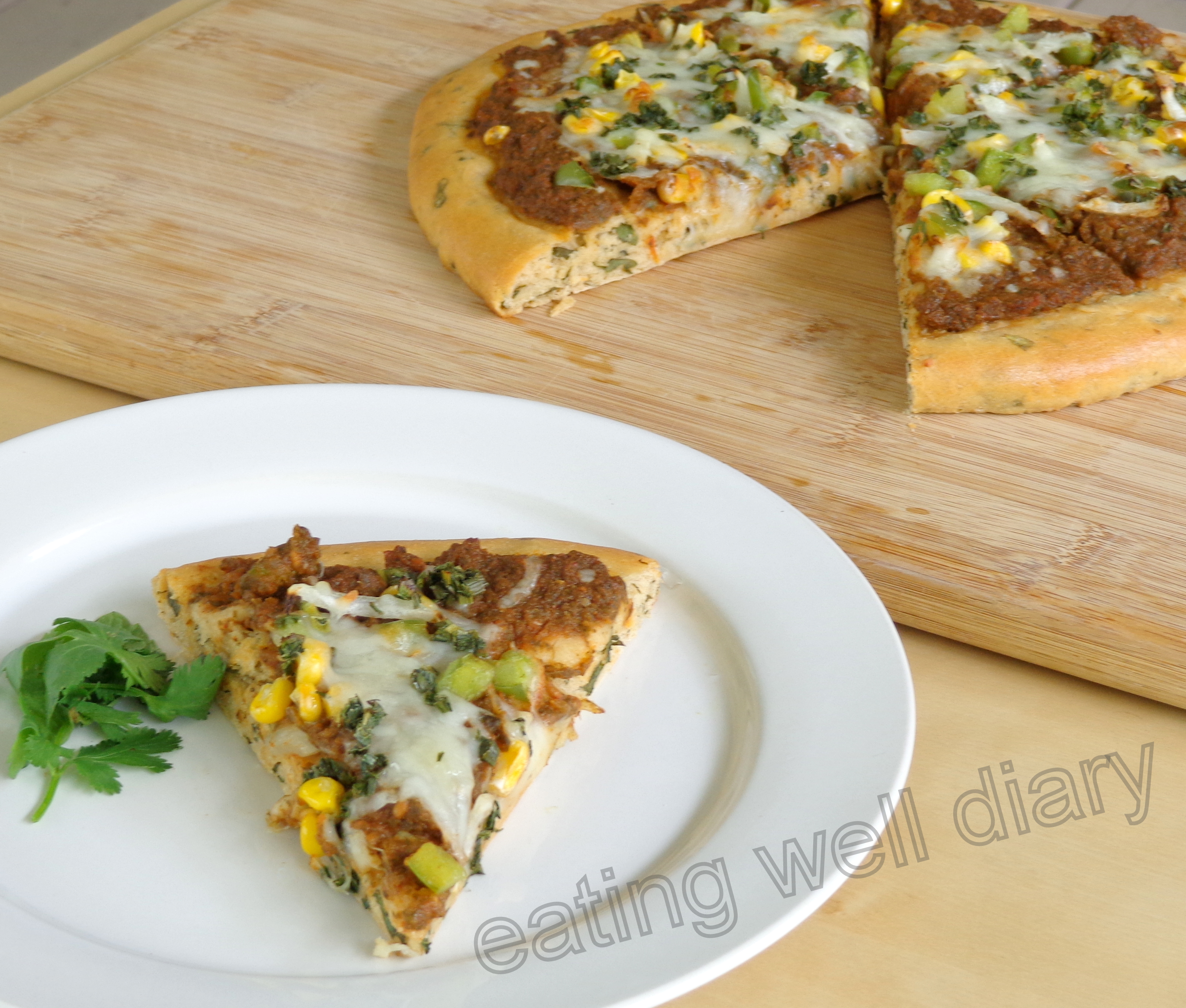 Herb-loaded pizza with homemade sauce (whole wheat)- Fiesta Friday Challenge 1