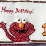 An Elmo themed vanilla birthday cake (whole wheat, eggless, natural colors)